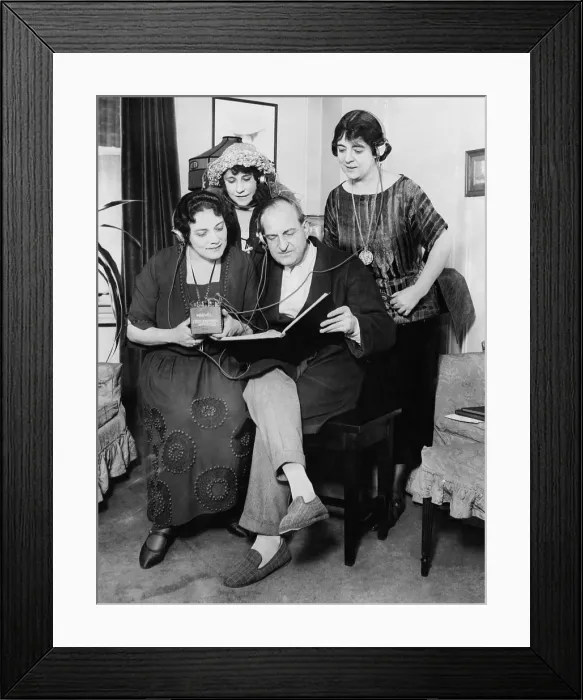Framed Print : Opera stars read score of Tosca while listening to the opera via radio headphones. Left to right: Alice Gentle, Queena Mario, Antonio Scotti, and Francesco Peralta. 1922 Framed Print : Opera stars read score of Tosca while listening to the opera via radio headphones. Left to right: Alice Gentle, Queena Mario, Antonio Scotti, and Francesco Peralta. 1922