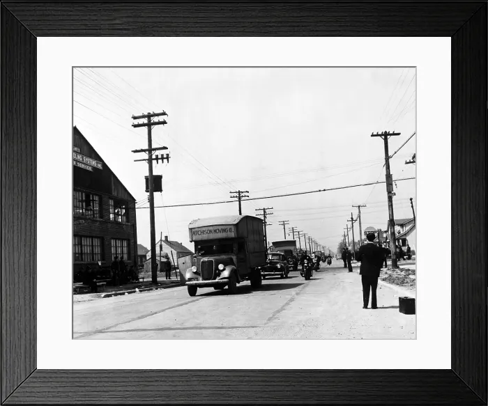 Framed Print : Integration. A convoy of African-American moving trucks protected by police cars. Whites had protested integration of the Sojourner Truth homes, a new U.S