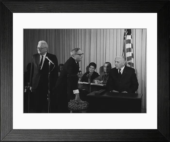 Framed Print : Vietnam War era Selective Service lottery. Congressman Alexander Pirnie pulls lottery capsules. At left is Selective Service Director Lt. General Lewis Blaine Hershey