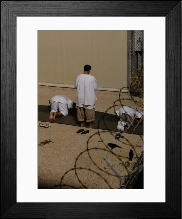 Framed Print : Islamic detainees pray at Camp Delta the military prison at Naval Station Guantanamo Bay Cuba. Oct. 28 2009. Photo by:Everett Collection(BSLOC_2011_6_162)