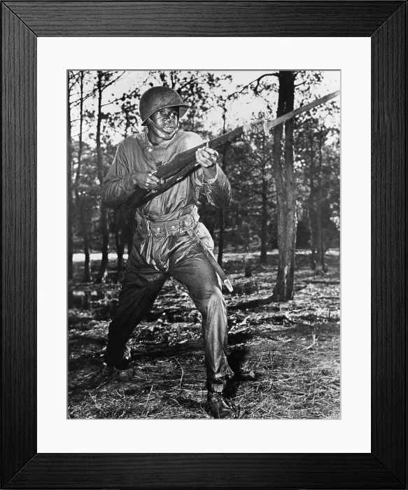 Framed Print : African-American soldier charging with bayonet fixed during World War II combat training at the U.S. Naval training center, Great Lakes, Illinois. Ca. 1942-45