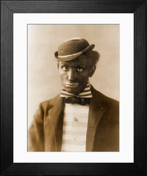Framed Print : White man in blackface as minstrel. Minstrel theater drew on the genius of African-America art forms, but negatively stereotyped and ridiculed blacks. Ca. 1900 Framed Print : White man in blackface as minstrel. Minstrel theater drew on the genius of African-America art forms, but negatively stereotyped and ridiculed blacks. Ca. 1900