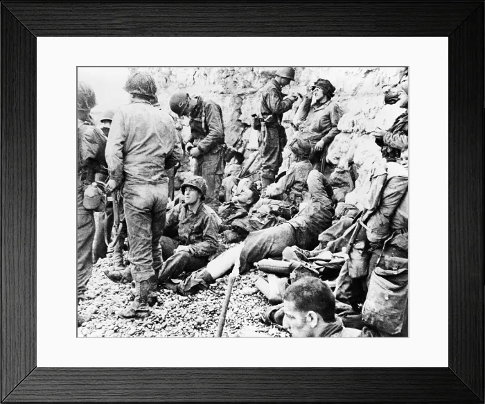 Framed Print : D-Day in Normandy, France. Allied assault troops relaxing before a protective chalk cliff overlooking the invasion shore, Normandy, France. June 6-7, 1944 Framed Print : D-Day in Normandy, France. Allied assault troops relaxing before a protective chalk cliff overlooking the invasion shore, Normandy, France. June 6-7, 1944