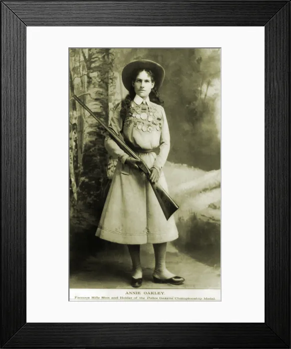 Framed Print : Annie Oakley (1860-1926) American sharpshooter bedecked with awards and medals in 1899