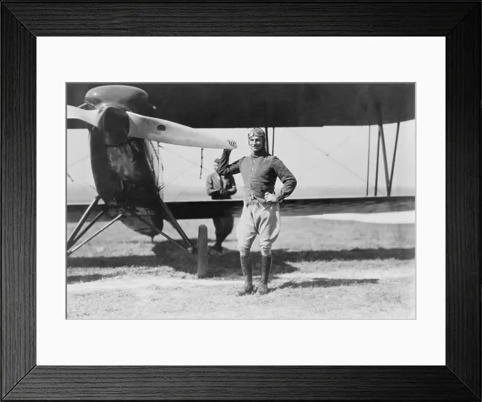 Framed Print : Brigadier General Billy Mitchell, the controversial advocate for military aviation, standing beside a pursuit plane, an early fighter. Ca. 1922