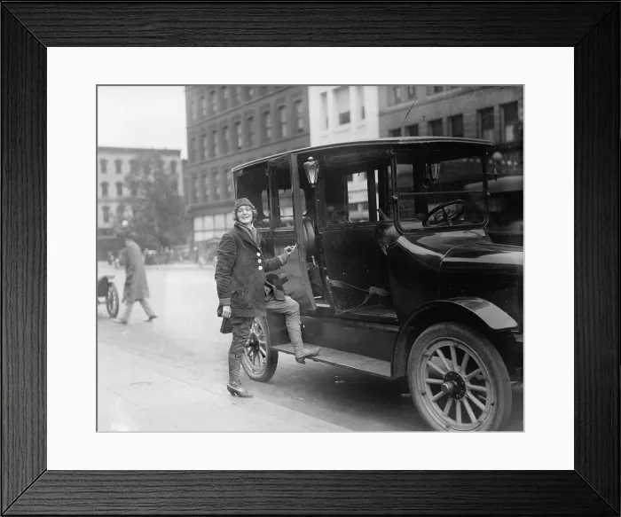 Framed Print : Women taxi driver, dressed in special driving costume, in Washington, D.C. in 1919 Framed Print : Women taxi driver, dressed in special driving costume, in Washington, D.C. in 1919