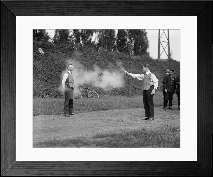 Framed Print : Washington, D.C. law enforcers test a new bullet proof vest in 1923 Framed Print : Washington, D.C. law enforcers test a new bullet proof vest in 1923