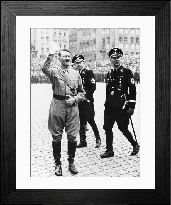 Framed Print : Adolf Hitler saluting, with two SS generals in uniform behind him, at Nazi Party Day, Nuremberg, Germany. 1937 Framed Print : Adolf Hitler saluting, with two SS generals in uniform behind him, at Nazi Party Day, Nuremberg, Germany. 1937