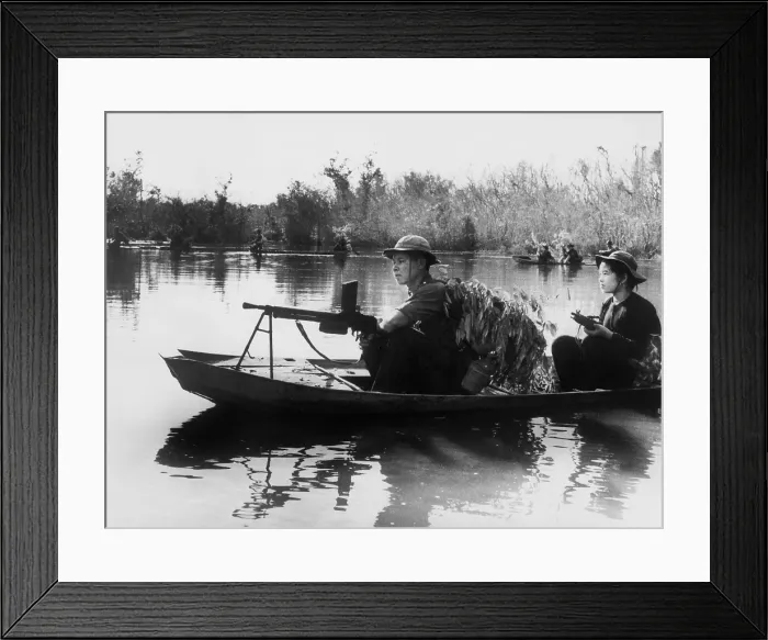 Framed Print : Viet Cong guerrillas in small boats patrol the Saigon River in South Vietnam in photo taken by communist forces Framed Print : Viet Cong guerrillas in small boats patrol the Saigon River in South Vietnam in photo taken by communist forces