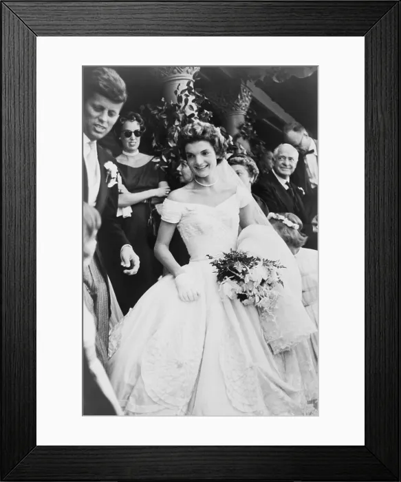 Framed Print : Jacqueline Bouvier Kennedy emerging from St. Mary's church in Newport Rhode, Island, on her wedding day. At far left is Senator Jack Kennedy