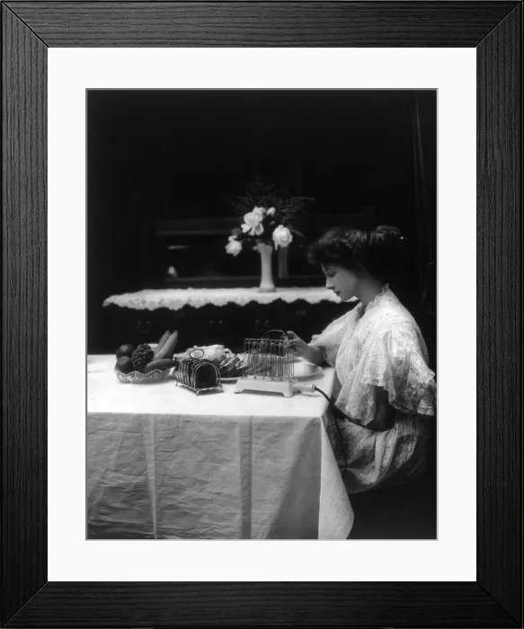 Framed Print : Woman using G.E. heating and cooking devices, c. 1908 Framed Print : Woman using G.E. heating and cooking devices, c. 1908