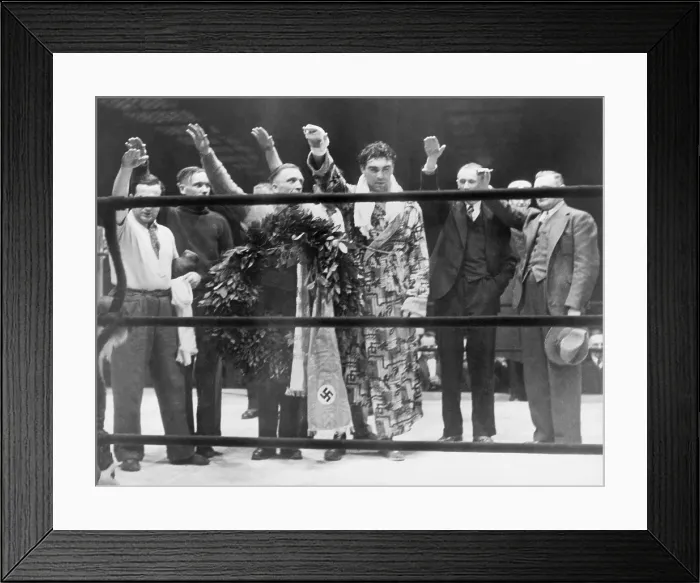 Framed Print : Max Schmeling, with attendants, giving the Nazi salute after his victory over Steve Hamas in Hamburg, Germany, March 10, 1935