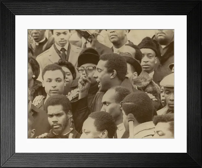 Framed Print : Profile of Stokely Carmichael speaking and gesturing in midst of crowd demonstrating near the Capitol in Washington, DC. January 10, 1967