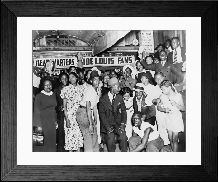 Framed Print : Joe Louis fans in front of fan headquarters to celebrate Louis close decision victory over Tom Farr, the famous Welsh / British boxer. Harlem, New York City, August 30, 1937