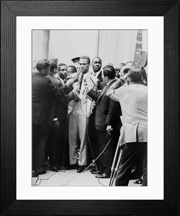 Framed Print : Malcolm X being interviewed by reporters in New York, 1964