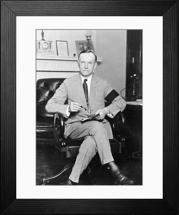 Framed Print : President Calvin Coolidge (1872-33), holding pen and paper, wearing black armband in mourning for President Harding on Aug. 4, 1923
