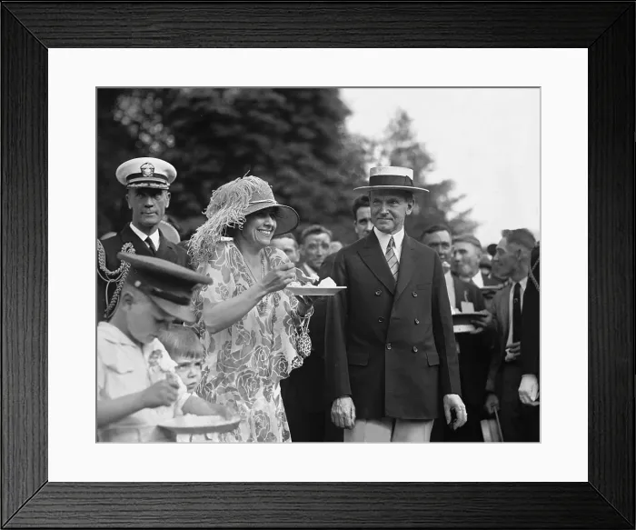 Framed Print : President Calvin Coolidge (1872-33) smiles along with his wife at a White House garden party in June 1926