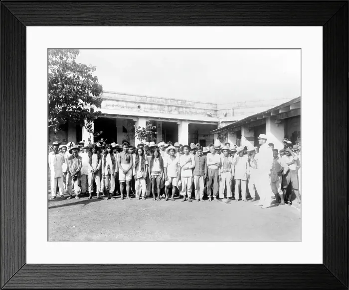 Framed Print : The Philippine-American War. Philipino prisoners of war, posed in courtyard. ca. 1899