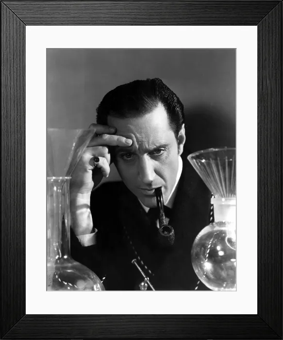 Framed Print : THE HOUND OF THE BASKERVILLES, Basil Rathbone, 1939, deep in thought as Sherlock Holmes, TM and Copyright (c) 20th Century Fox Film Corp. All rights reserved