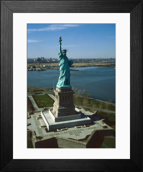 Framed Print : Statue of Liberty, New York Harbor. Aerial view looking northwest, Bayonne is on the horizon. 1978 Framed Print : Statue of Liberty, New York Harbor. Aerial view looking northwest, Bayonne is on the horizon. 1978
