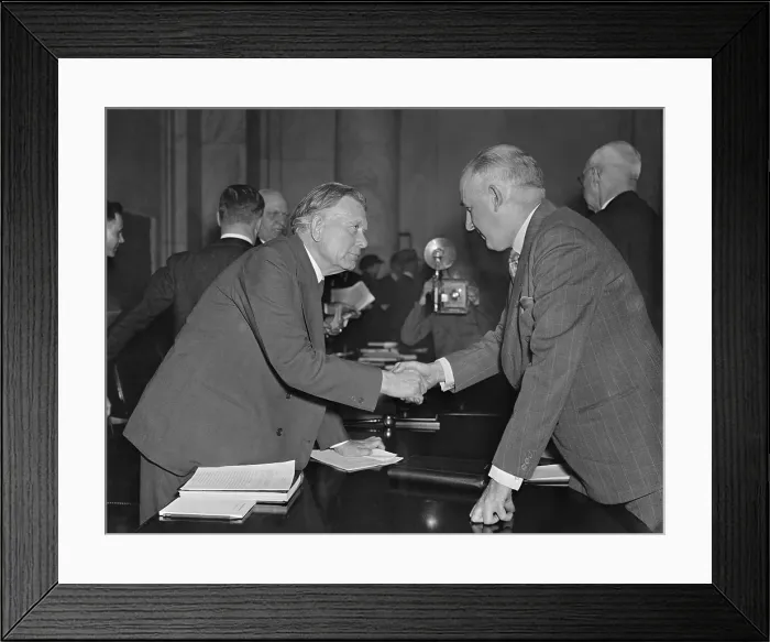 Framed Print : William Borah greets former Brain Truster Raymond Moley. Mar. 23, 1937. Moley joined Borah and the Republicans in opposition to FDR's court packing scheme