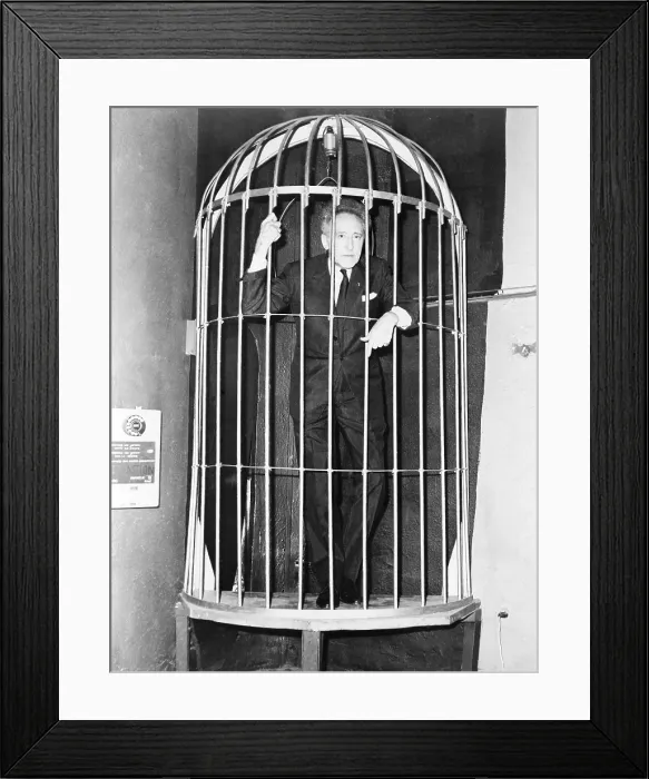 Framed Print : Jean Cocteau (1889-1963), inside a huge bird case during cocktail party he gave in Paris, on the occasion of his new play, THEATRE FORAIN, March 15, 1961 Framed Print : Jean Cocteau (1889-1963), inside a huge bird case during cocktail party he gave in Paris, on the occasion of his new play, THEATRE FORAIN, March 15, 1961