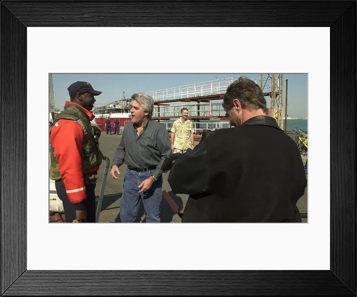 Framed Print : Jay Leno greets sailors at an undisclosed location during the first months of US operations in Afghanistan after the al Qaeda's 9 / 11 attacks on the US. Dec. 23 2001