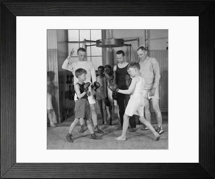 Framed Print : Theodore Roosevelt Jr. (1887-1944), coaching boys in a boxing match. His son, Cornelius, is the boy fighting on the left. March 22, 1924
