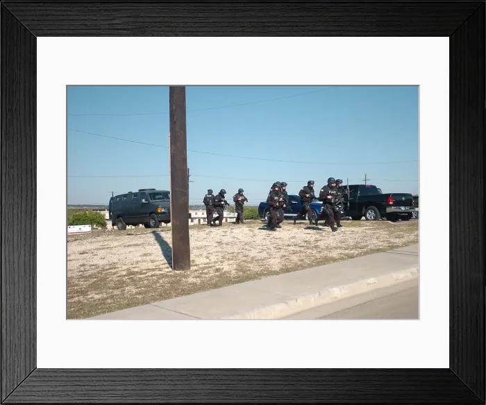 Framed Print : US Army SWAT team approaching a building where home-grown terrorist Major Nidal Malik Hasan is held up at Fort Hood Texas Nov. 5 2009 Framed Print : US Army SWAT team approaching a building where home-grown terrorist Major Nidal Malik Hasan is held up at Fort Hood Texas Nov. 5 2009