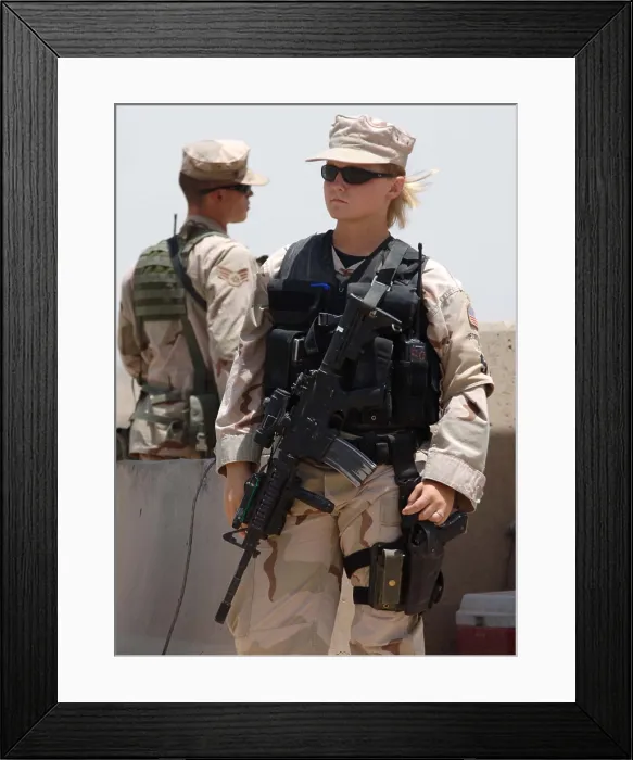 Framed Print : Two US Airman stand watch at Sather Air Base in Iraq. One is female in combat gear. Ca. 2008. (BSLOC_2011_12_368)