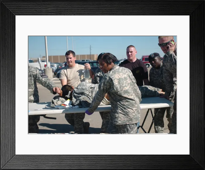 Framed Print : US Army first responders use a table as a stretcher for a soldier wounded by home-grown terrorist Major Nidal Malik Hasan an American-born Muslim of Palestinian descent Framed Print : US Army first responders use a table as a stretcher for a soldier wounded by home-grown terrorist Major Nidal Malik Hasan an American-born Muslim of Palestinian descent