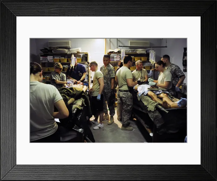 Framed Print : Afghan soldiers seriously wounded by an improvised explosive device in Najabad Afghanistan at a US field medical unit on April 23 2010. (BSLOC_2011_12_357)