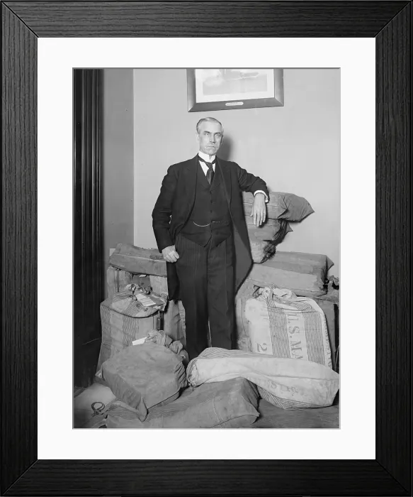 Framed Print : Reed Smoot (1862-1941) the first Mormon U.S. Senator poses, in his office with mailbags. In 1919 Smoot opposed ratification of the Treaty of Versailles and U.S