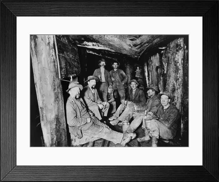 Framed Print : Seven miners pose for a photograph after lunch in the Last Chance Company mine in the Coeur d'Alene region of Idaho. The region was rich in silver, lead, gold and copper. Ca