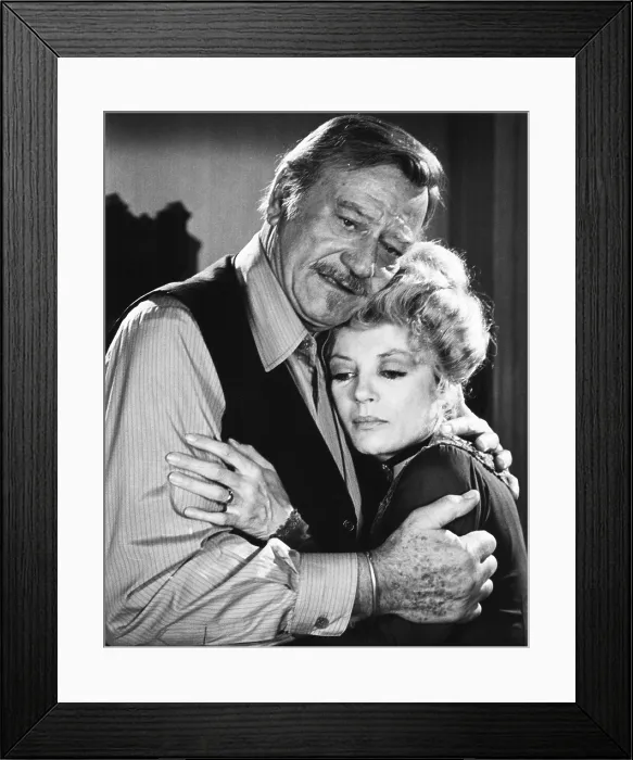 Framed Print : THE SHOOTIST, from left: John Wayne, Sheree North, 1976 Framed Print : THE SHOOTIST, from left: John Wayne, Sheree North, 1976