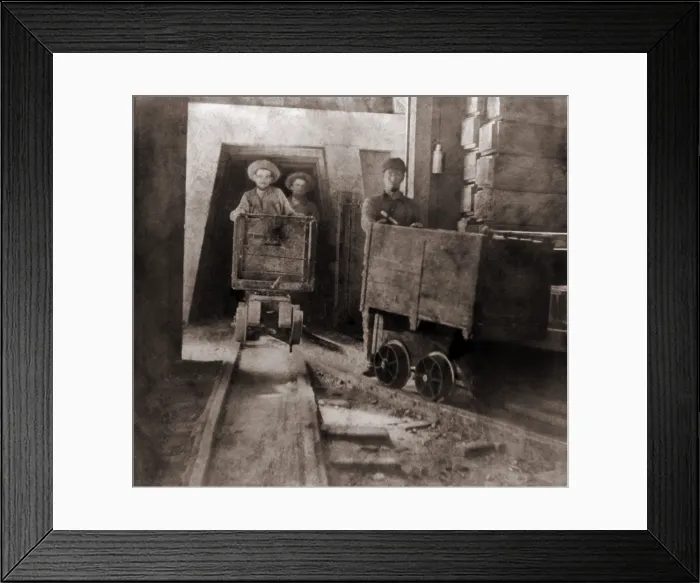 Framed Print : Miners pushing ore carts through the tunnels of the Gould & Curry Mine in Virginia City, Nevada