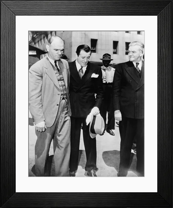 Framed Print : Benny Bugsy Siegel (1906-1947), under arrest and in the custody of U.S. Marshals in Los Angeles. 1941. Warren Beatty played Seigel in the 1991 film BUGSY