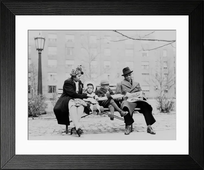 Framed Print : An African American family on a park bench in an urban neighborhood. Ca. 1942 Framed Print : An African American family on a park bench in an urban neighborhood. Ca. 1942