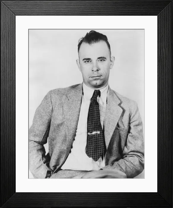 Framed Print : John Dillinger (1903-1934), famous bank robber, in police custody in September 1933, would soon be freed by five former convict pals from the Indiana State Prison