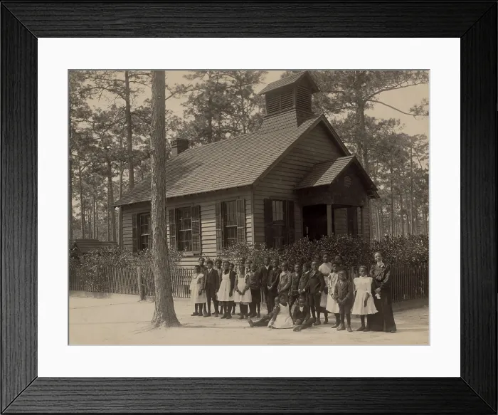 Framed Print : African American school children posed with their teacher outside a segregated one-room school, in South Carolina. Ca. 1905