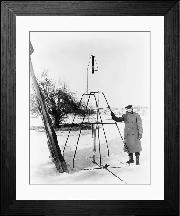 Framed Print : Robert H. Goddard (1882-1945), standing next to the first liquid fueled rocket prior to its successful launch on March 16, 1926