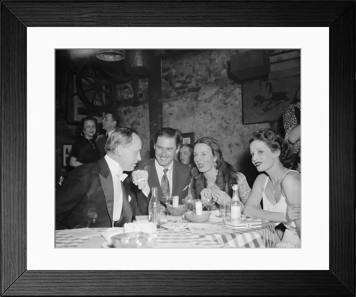 Framed Print : Harry Hopkins, Commerce Sec. out on the town with famous friends. Feb. 8, 1939. At a Washington supper club, L-R: Hopkins; actor Errol Flynn, and Mrs