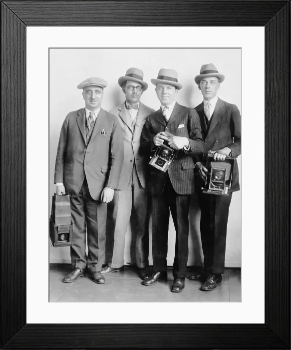Framed Print : Four members of the White House News Photographers Association, holding cameras in 1924