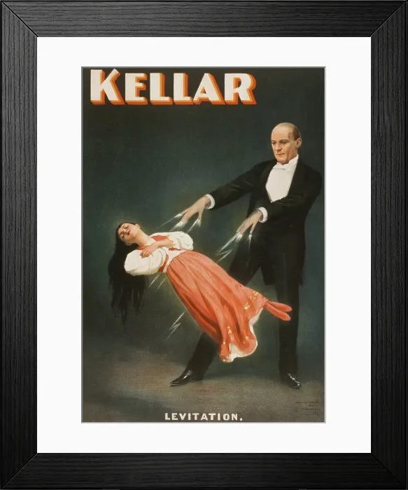 Framed Print : Harry Kellar (1849-1922), American magician performing a levitation illusion. 1894 Framed Print : Harry Kellar (1849-1922), American magician performing a levitation illusion. 1894