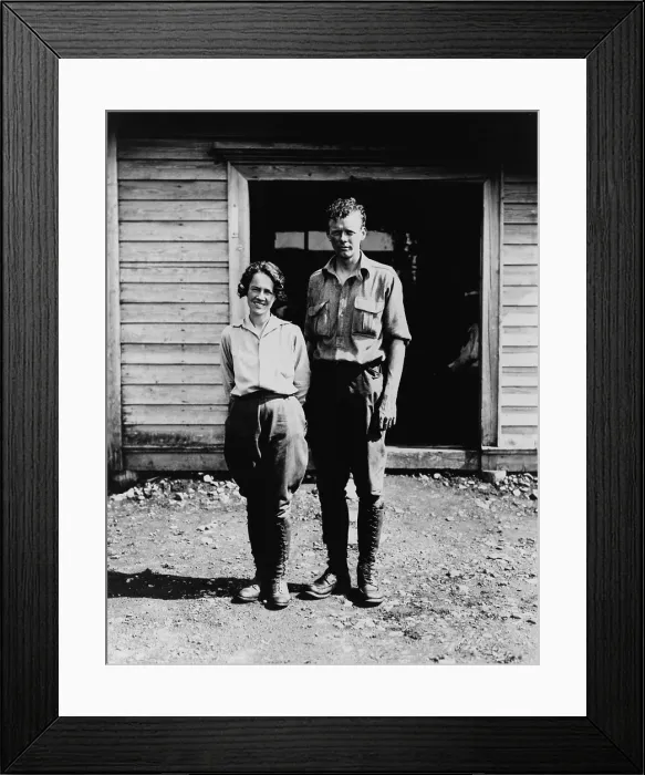 Framed Print : Charles and Anne Morrow Lindbergh, standing in front of cabin on Etarofu Island, Russia in 1935