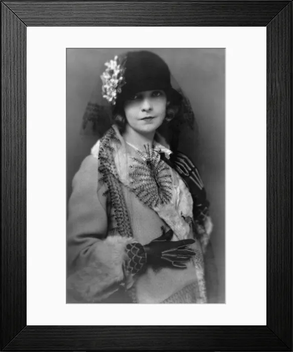 Framed Print : Lillian Gish (1893-1993), silent film star and wearing coat and hat with flower and long veil. 1922 portrait by society photographer, Charles Albin