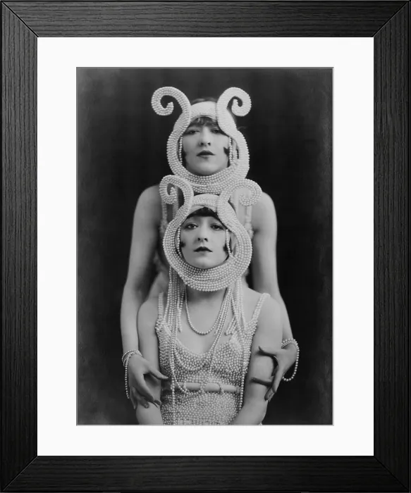 Framed Print : The Dolly Sisters, a tandem dance team famous in the 1910s and 1920s, wearing costumes made of pearls