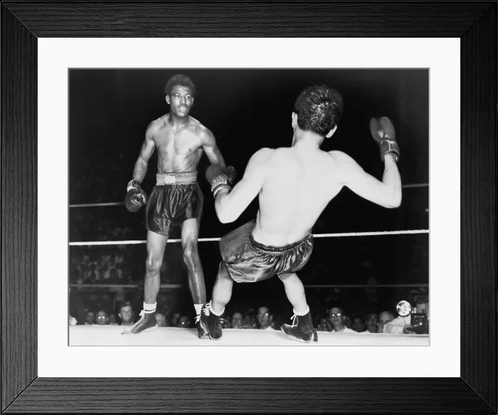 Framed Print : Sugar Ray Robinson (1921-1989) watching Jimmy Doyle fall backwards after receiving a knockout punch. Doyle later died of injuries from his fall. 1947 Framed Print : Sugar Ray Robinson (1921-1989) watching Jimmy Doyle fall backwards after receiving a knockout punch. Doyle later died of injuries from his fall. 1947