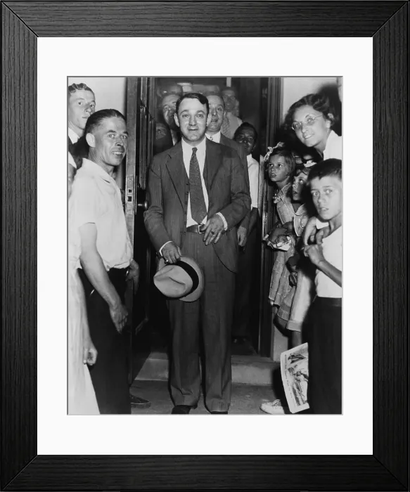 Framed Print : Dutch Schultz, emerging from doorway of Malone County jail, in an upstate New York town where he was on trial for federal tax evasion Framed Print : Dutch Schultz, emerging from doorway of Malone County jail, in an upstate New York town where he was on trial for federal tax evasion