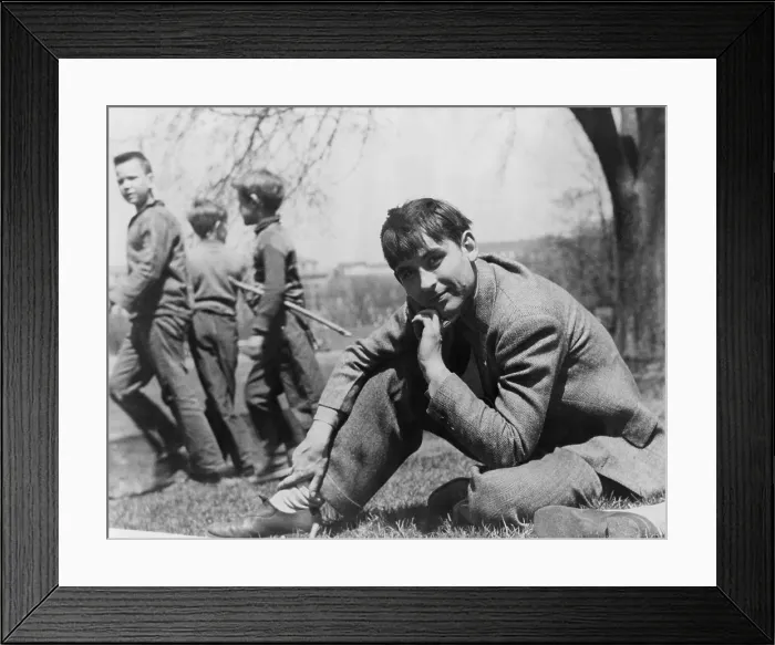 Framed Print : John Collier, Jr. (b. 1913), American photographer with the Farm Security Administration, seated on lawn with boys in the background. 1943 Framed Print : John Collier, Jr. (b. 1913), American photographer with the Farm Security Administration, seated on lawn with boys in the background. 1943